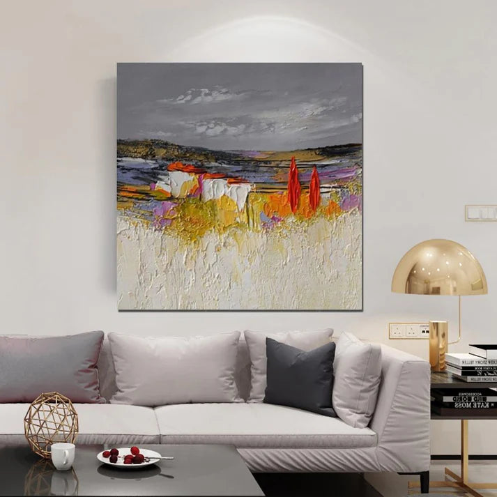 Abstract painting on a wall above a sofa in a living room