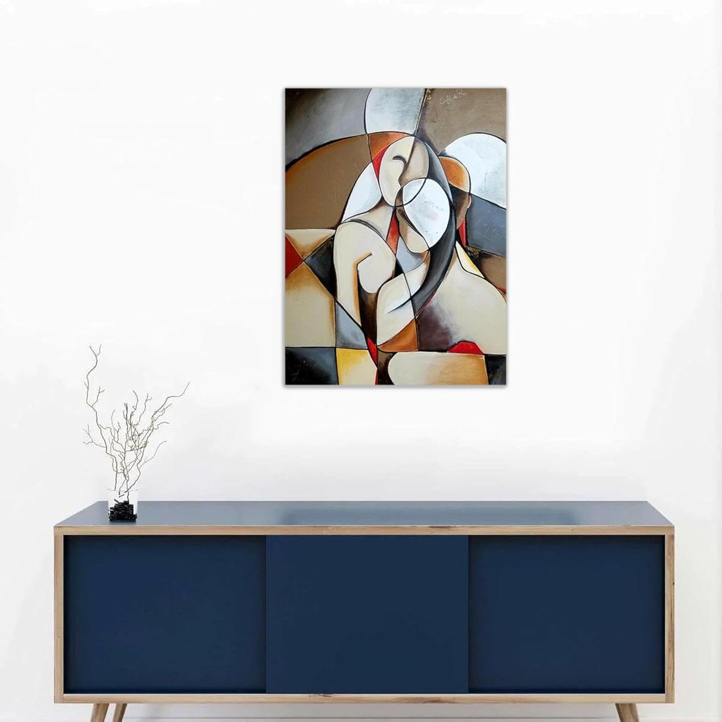 Abstract painting on a wall above a blue cabinet