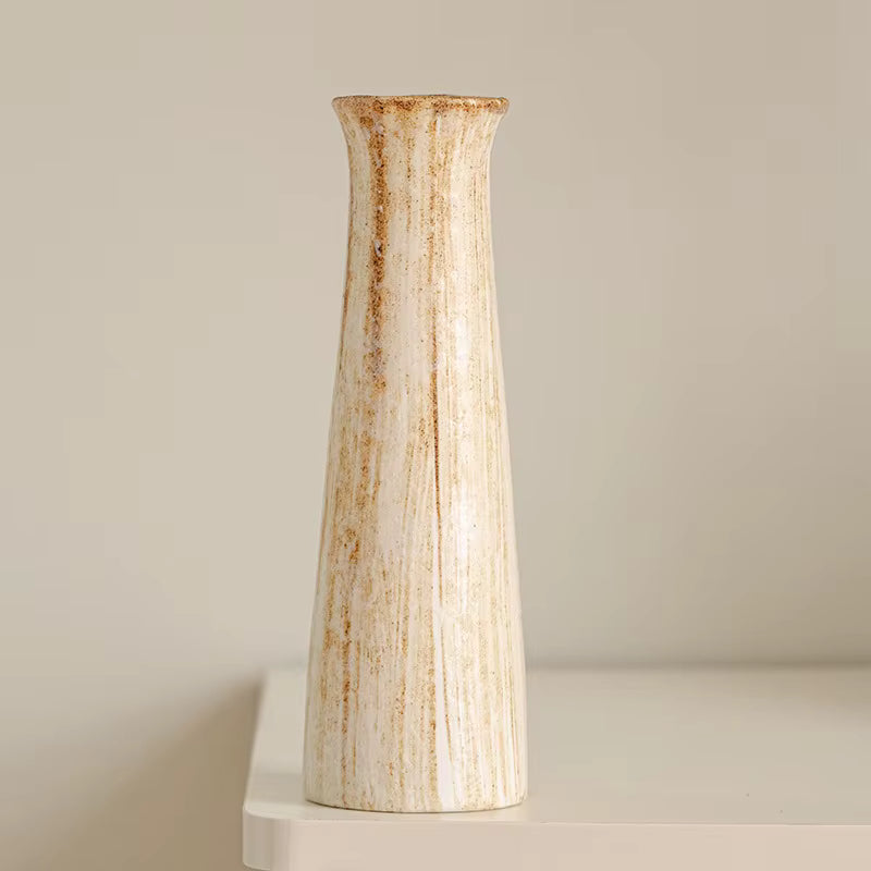 Decorative vase with a textured surface on a neutral background