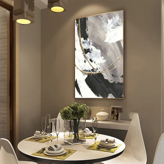 Dining room with a table set for four, abstract art on the wall, and a vase with flowers.