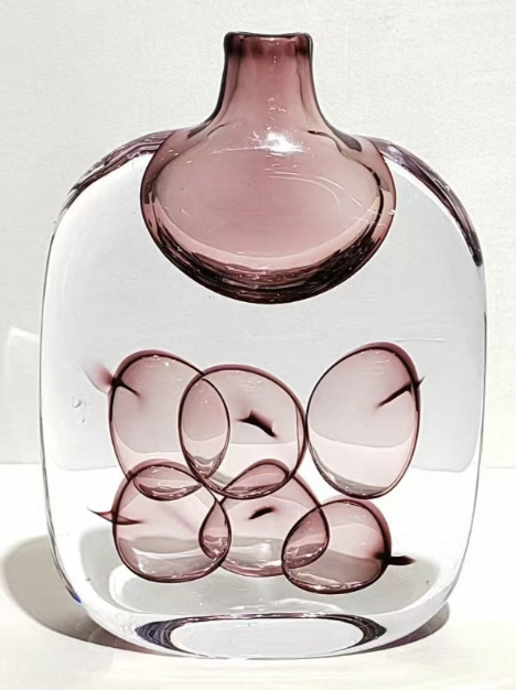 Glass vase with a unique design on a white background