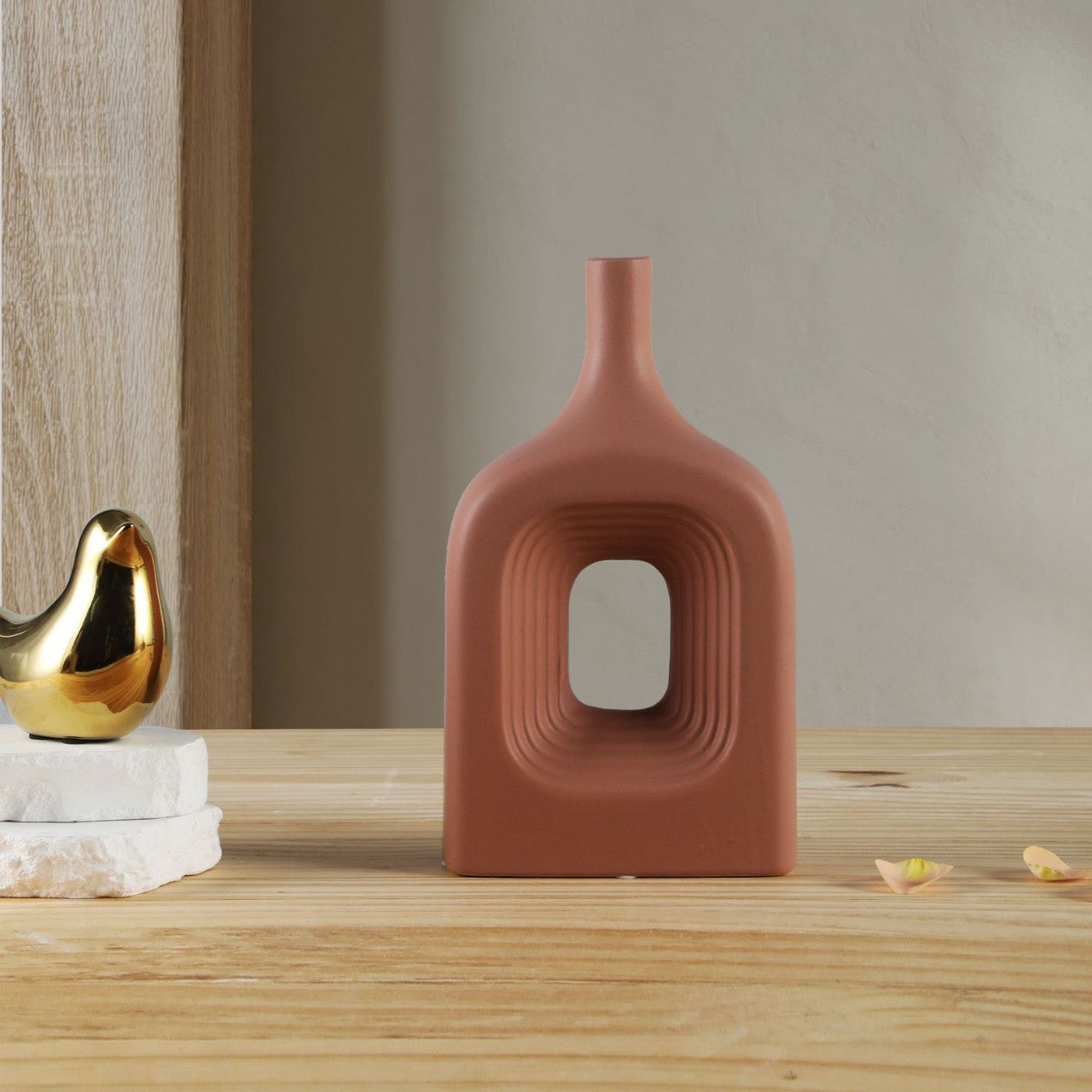 Decorative vase with a unique design on a wooden surface