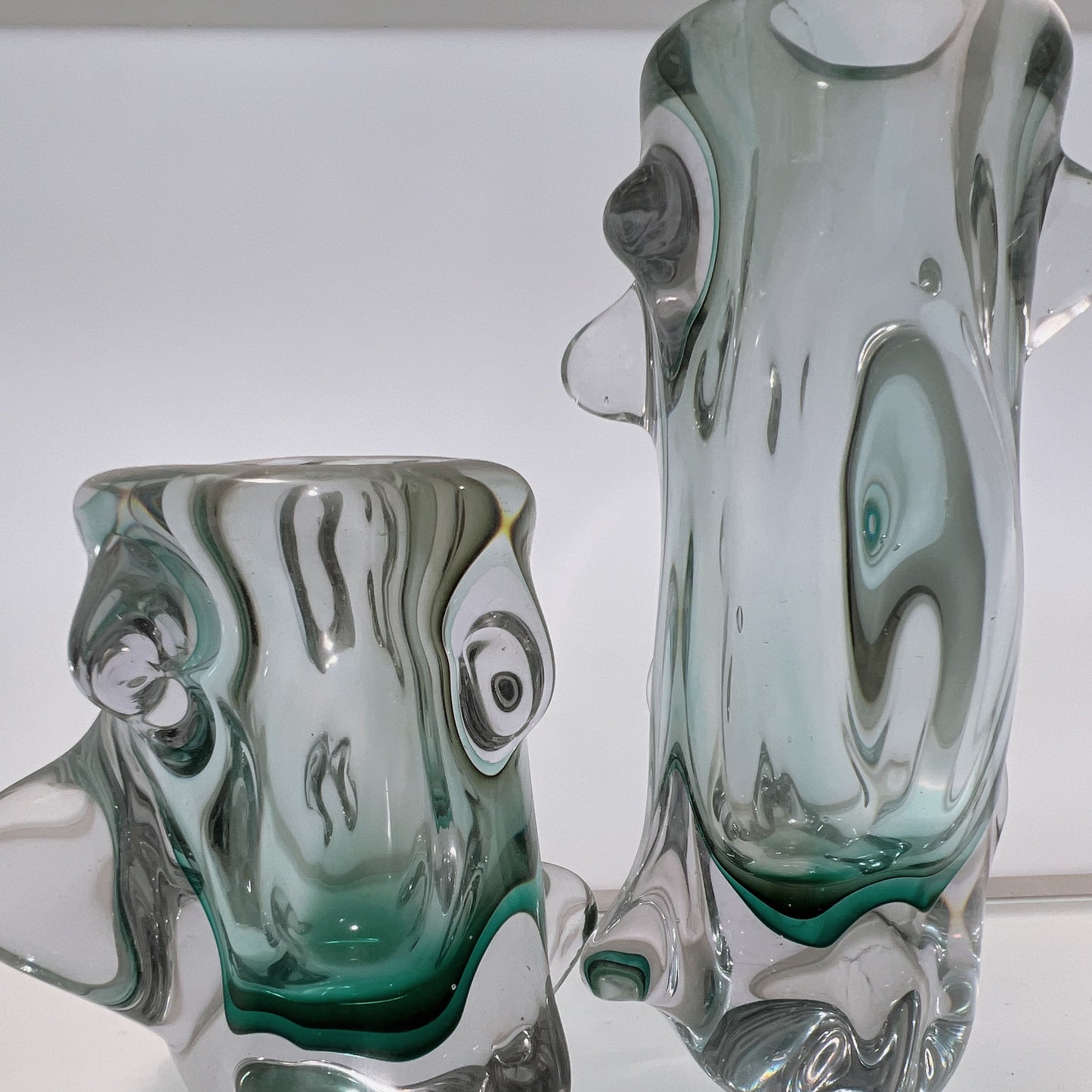 Two glass vases with a marbled design on a white background