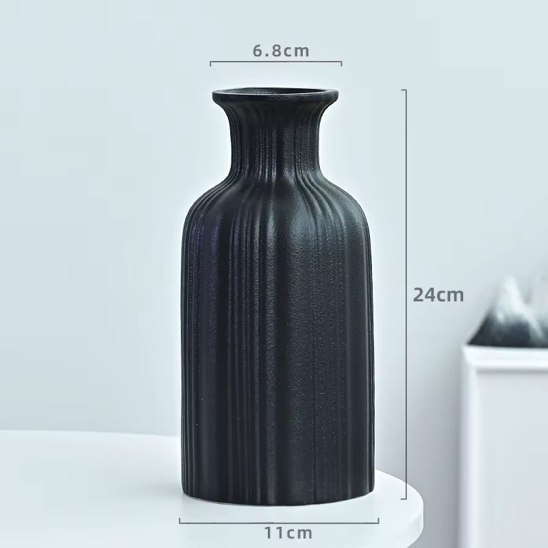 Black textured vase with dimensions on a light gray background
