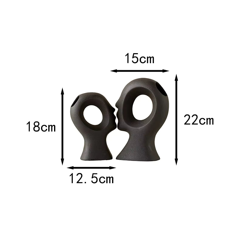 Two black rubber duckies with measurements on a white background
