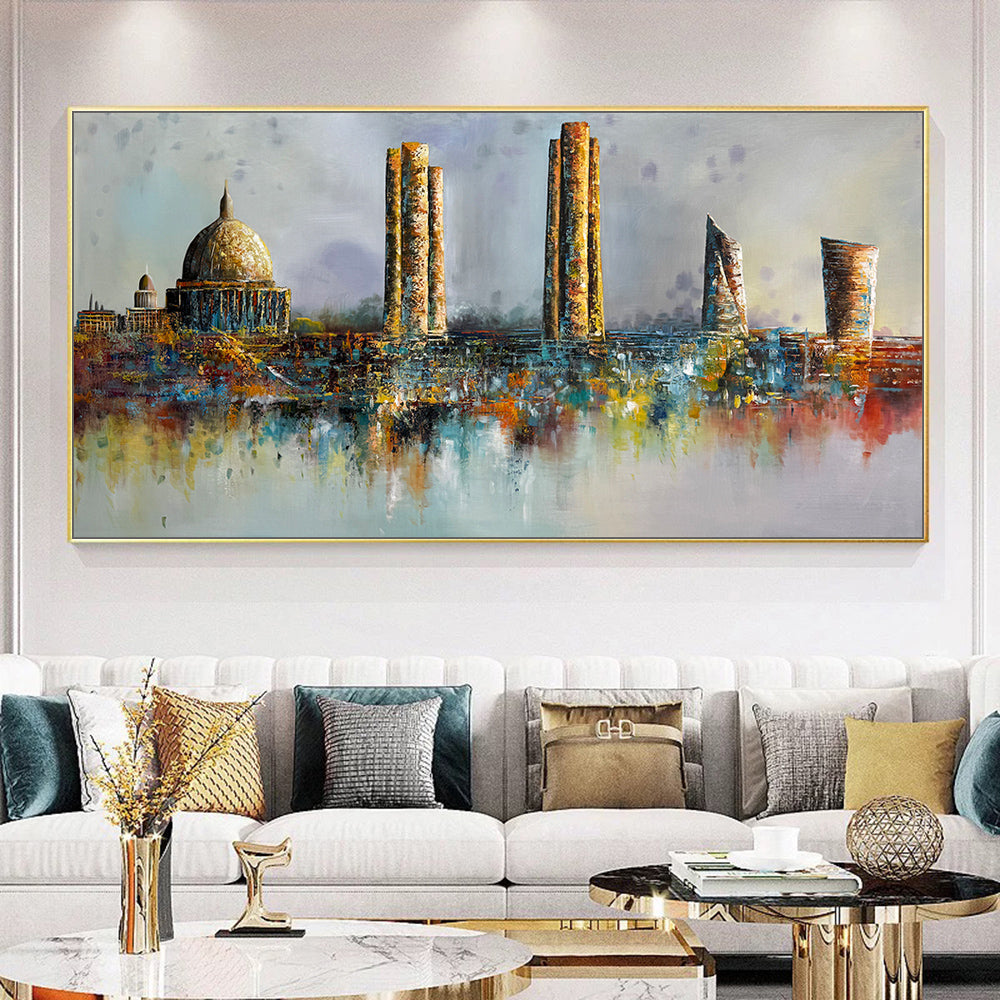 Colorful abstract cityscape painting on a wall above a sofa