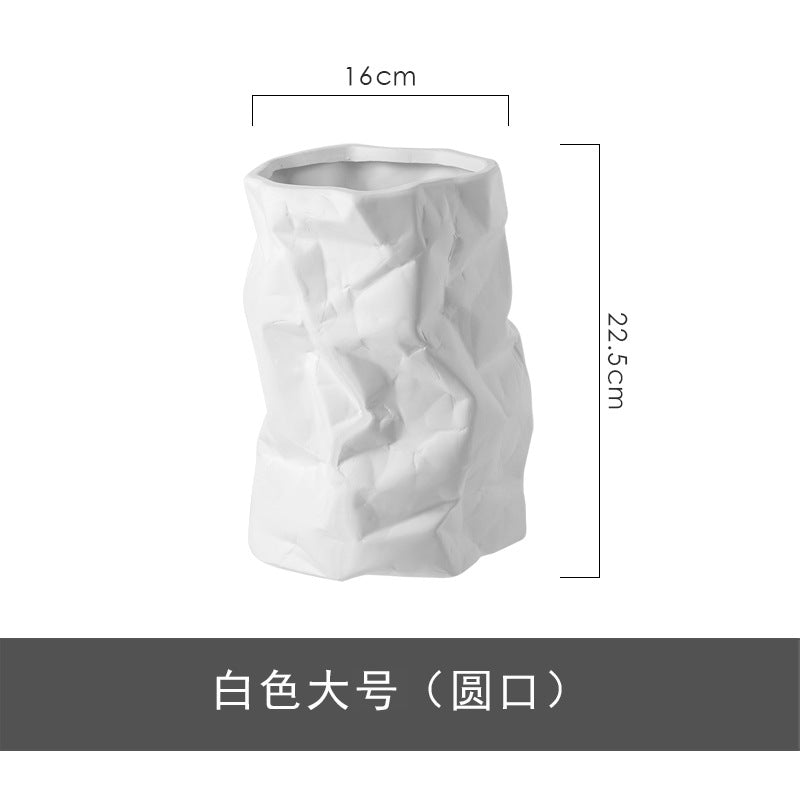 White ceramic vase with crumpled texture and dimensions on a white background