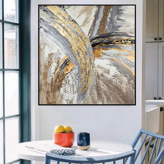 Abstract art piece in a modern kitchen setting with a table and chair.