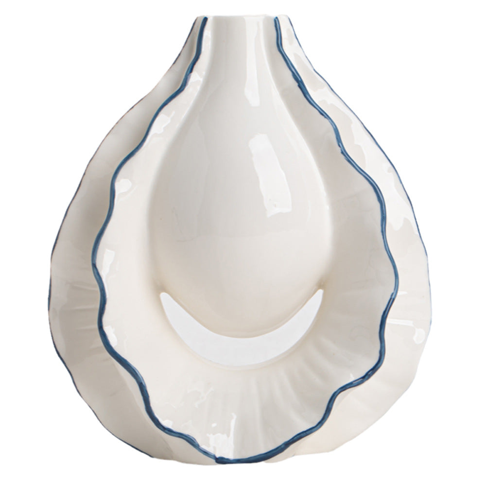 White ceramic dish with blue rim on a white background
