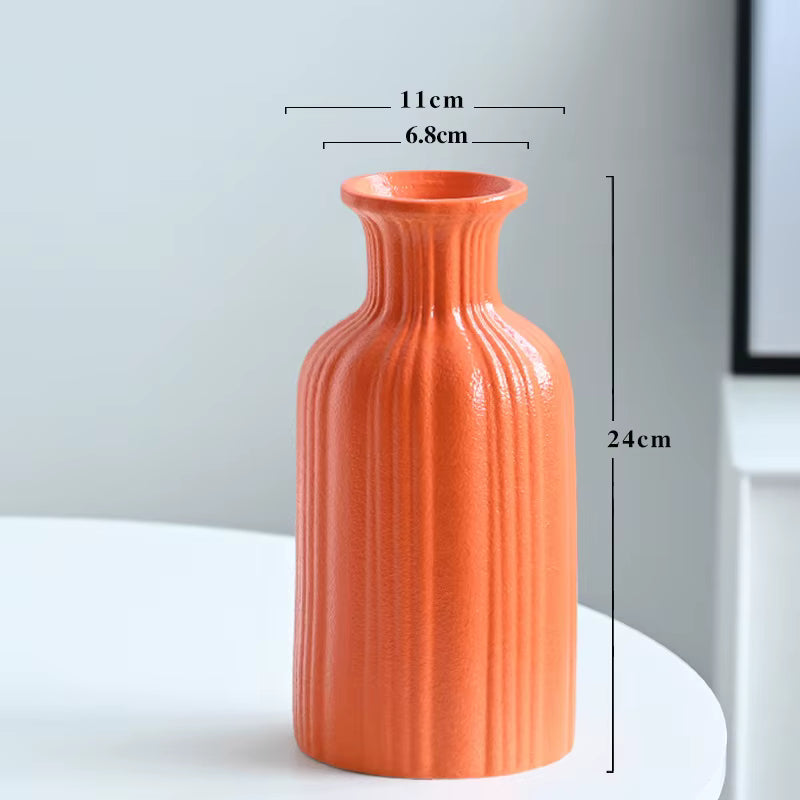 Orange textured vase with dimensions on a light gray background