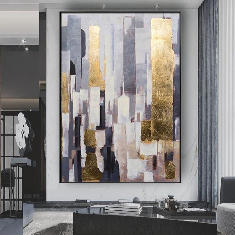Abstract art piece with gold and gray tones in a modern living room setting.