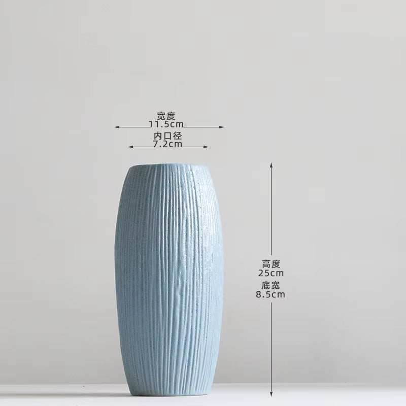 Blue textured vase with dimensions on a light gray background