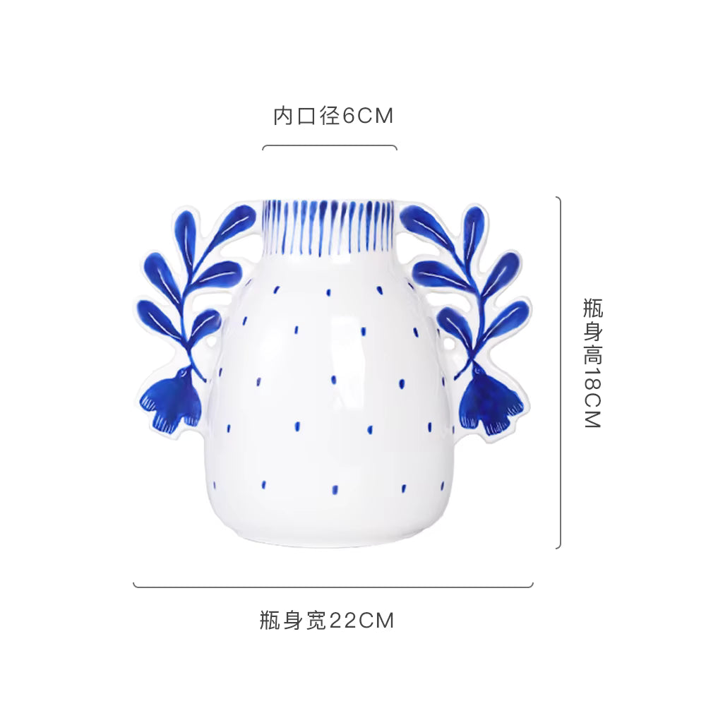 White vase with blue floral designs and measurements on a white background