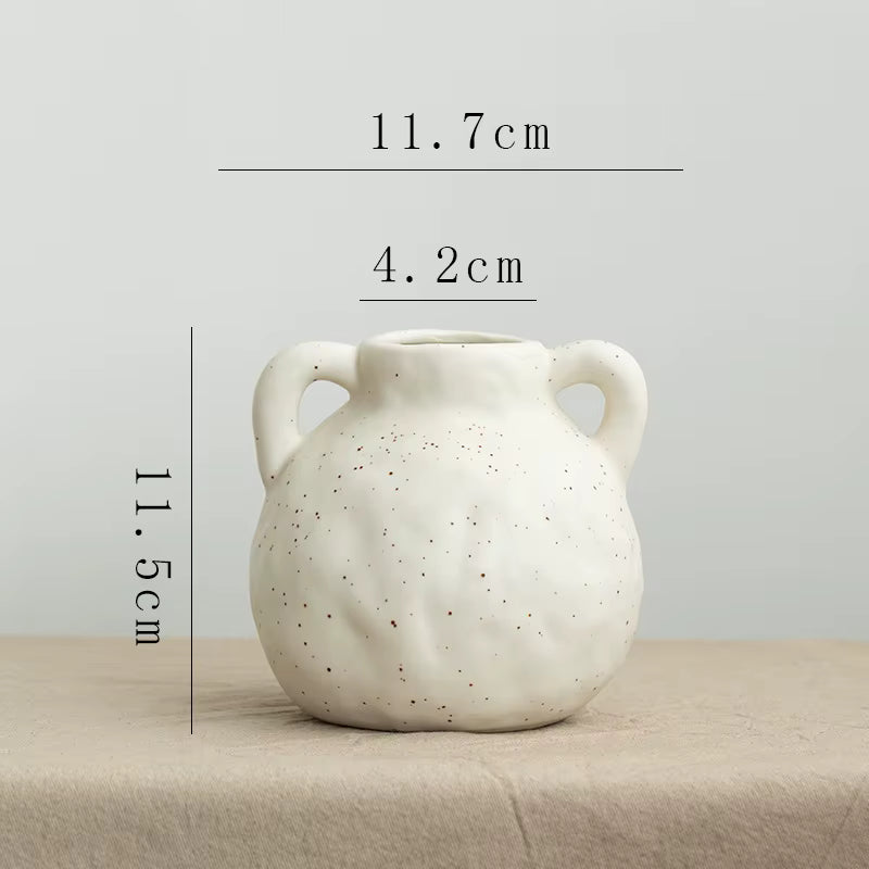 White ceramic vase with dimensions on a neutral background