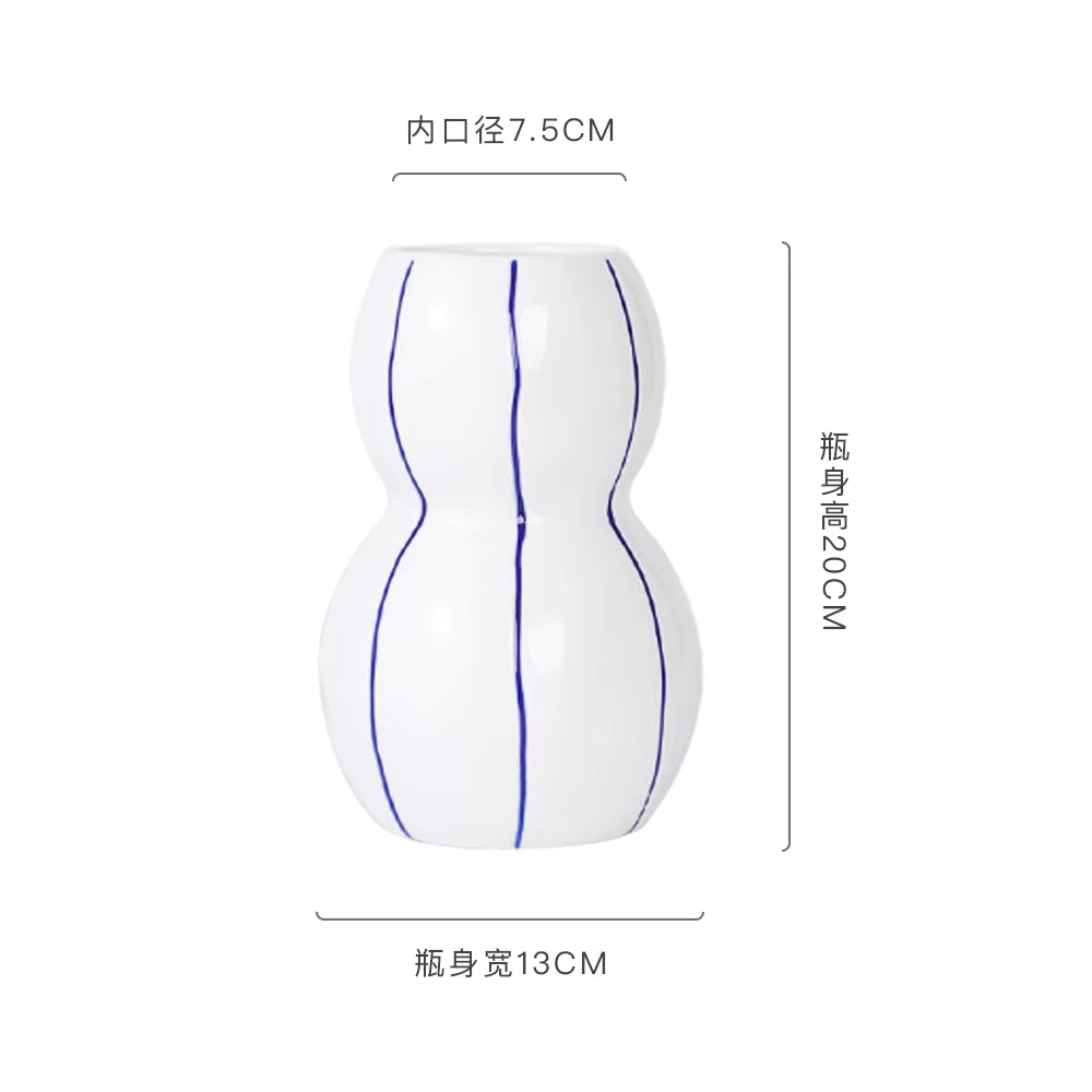 White bottle-shaped object with blue lines and measurements on a white background