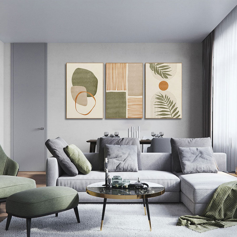 Modern living room with a gray sofa, green ottoman, and abstract art on the wall.