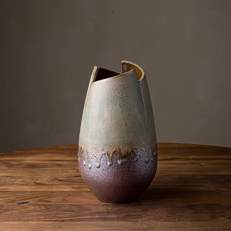 Ceramic vase with textured surface on a wooden table