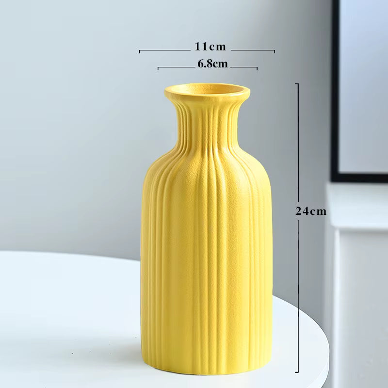 Yellow vase with measurements on a white surface