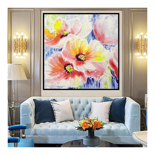 Decorative floral painting above a light blue sofa in a living room setting.