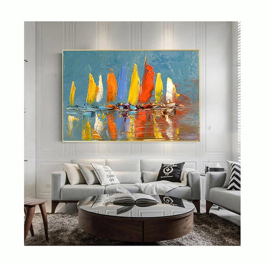 Colorful sailboat painting on a wall above a living room sofa.