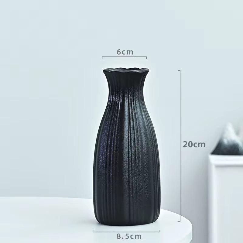 Black textured vase with dimensions on a light gray background