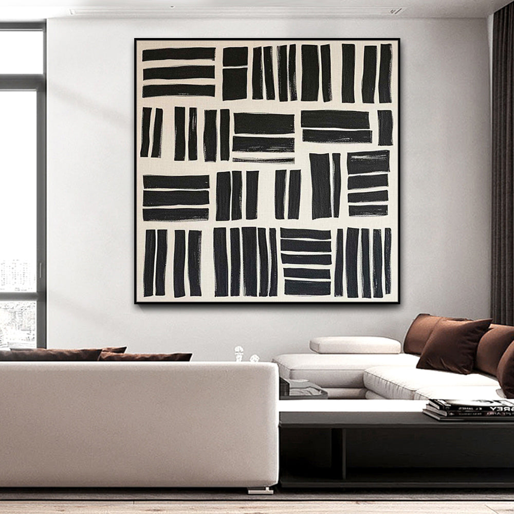 Modern living room with abstract black and white artwork on the wall