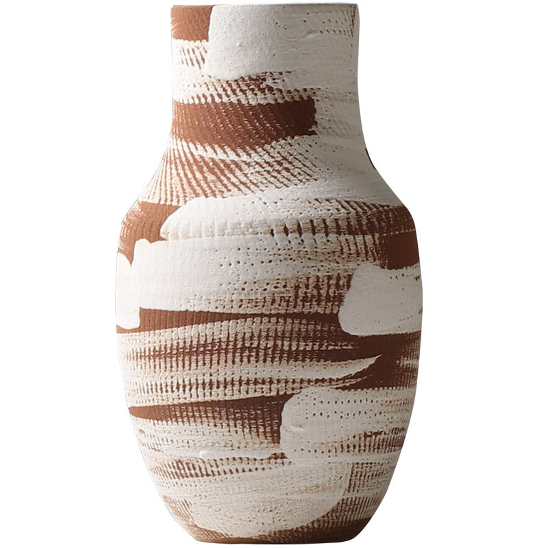 Decorative vase with brown and white pattern on a white background