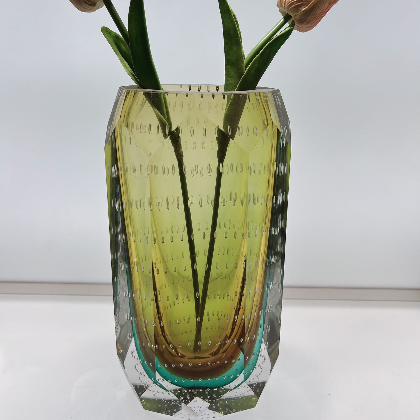 Decorative glass vase with a textured pattern on a white surface