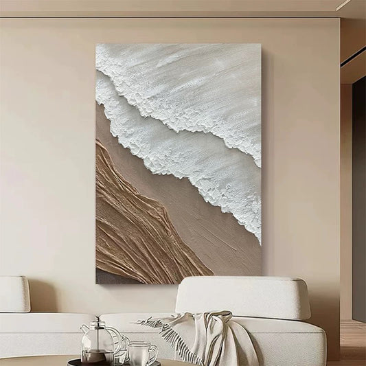 Abstract wall art piece on a beige wall above a white sofa.
