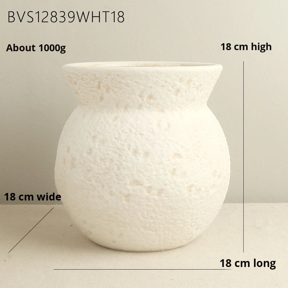 White textured vase with measurements on a neutral background
