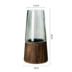 Tall glass candle holder with wooden base and dimensions on a white background