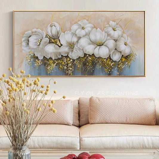 Framed floral artwork above a beige sofa with decorative elements.
