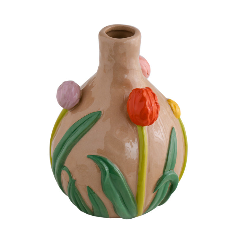 Ceramic vase with floral designs on a white background