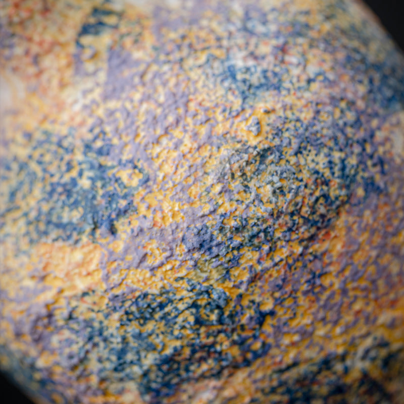 Close-up of a textured surface with orange and blue colors