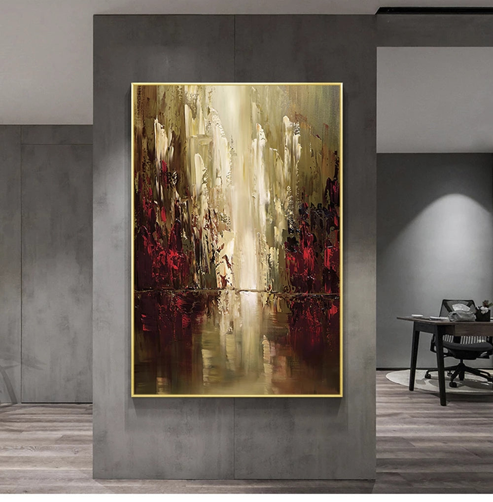 Abstract painting with gold frame on a gray wall