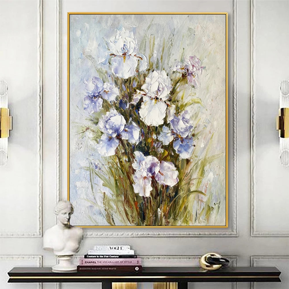 Framed floral painting on a wall above a console table with decorative items.
