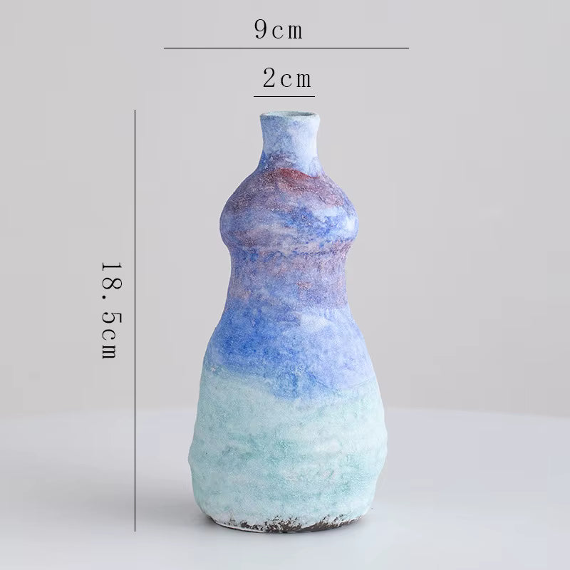 Decorative vase with gradient blue and white color on a light gray background