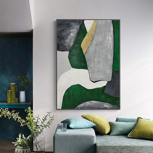 Abstract art piece on a wall in a living room with green and gray tones.