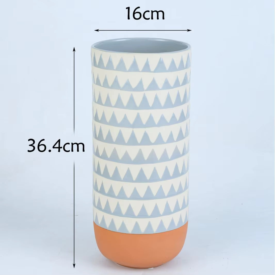 Cylindrical container with geometric pattern and measurements on a light blue background