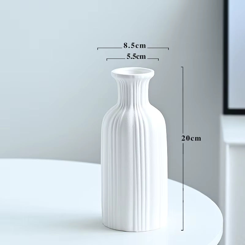 White textured vase with dimensions marked on a plain background