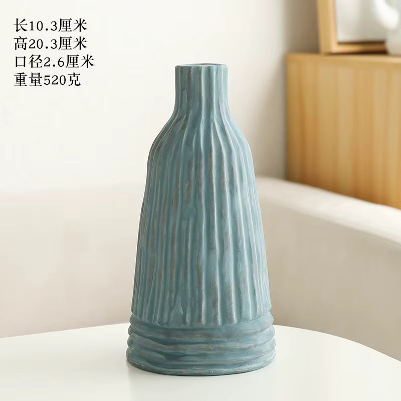 Blue textured vase on a white surface with text overlay