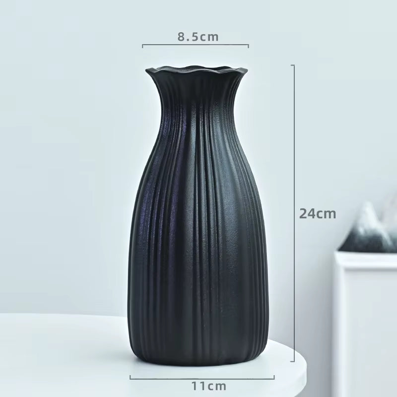 Black textured vase with dimensions on a light gray background