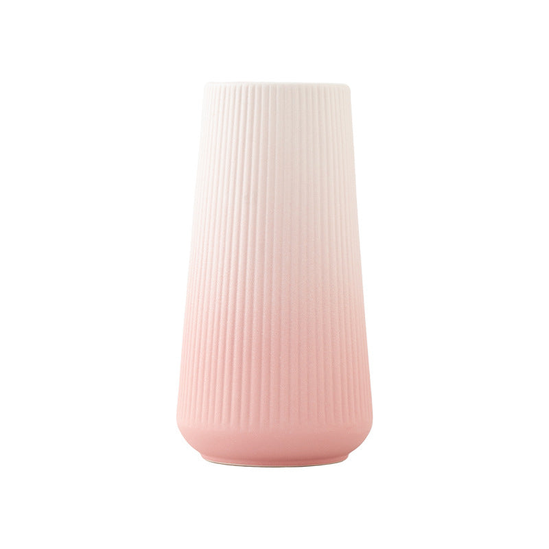 Pink textured vase on a white background