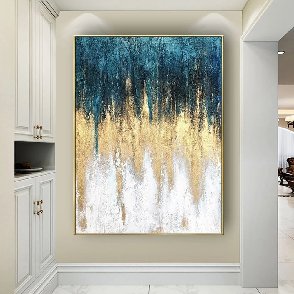 Abstract painting with blue, gold, and white colors on a wall in a modern interior setting.