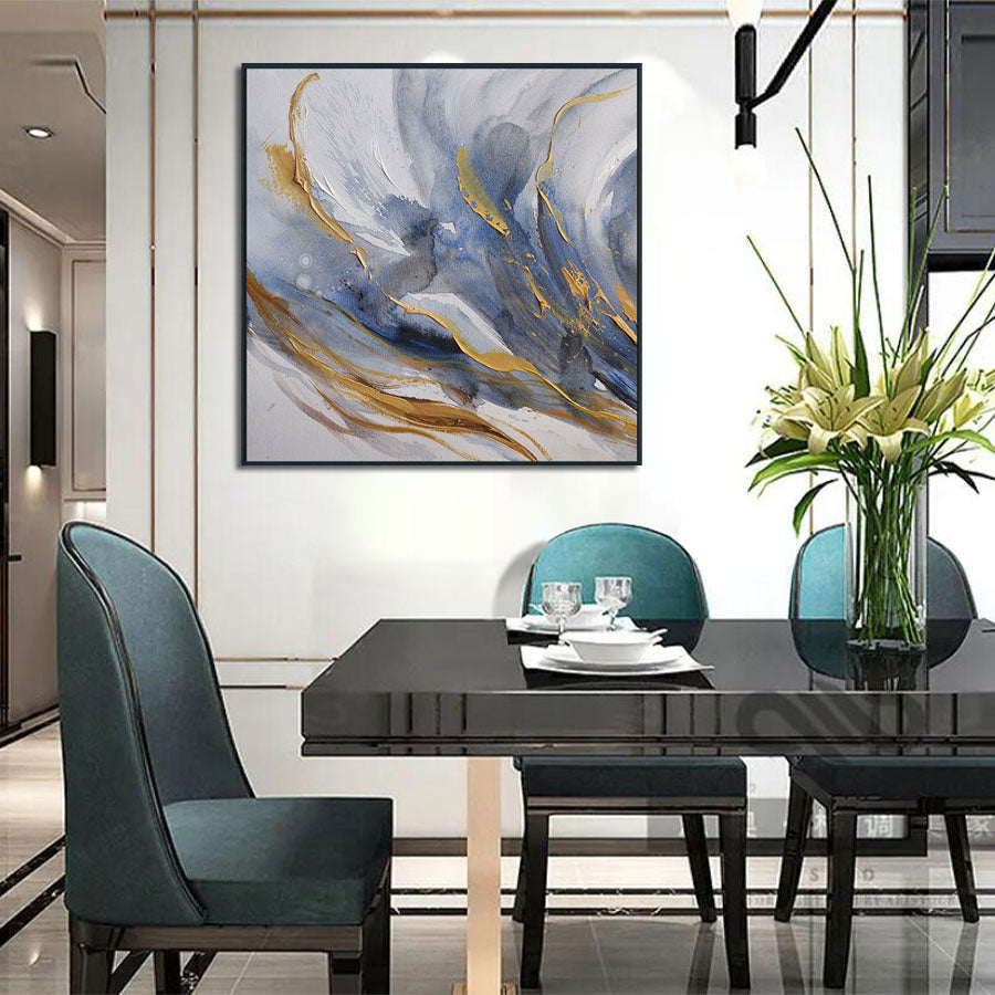 Dining room with a black table, blue chairs, and abstract art on the wall.