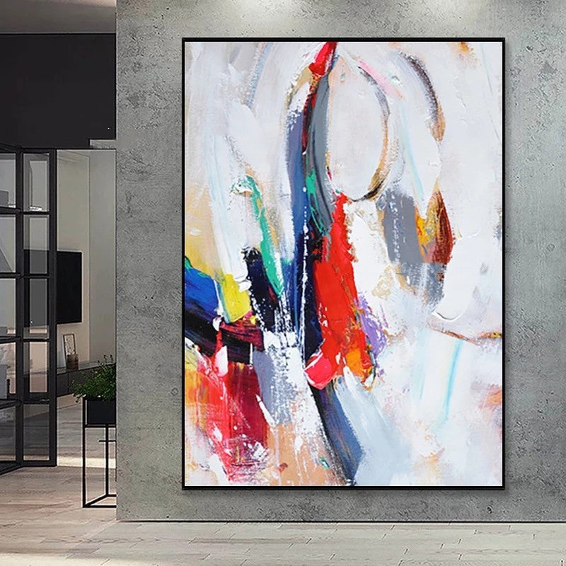 Abstract painting with colorful circles on a gray wall
