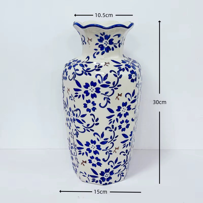 Ceramic vase with blue floral patterns and measurements on a white background