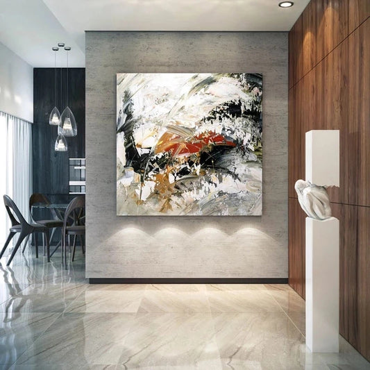 Modern interior with abstract painting on a wall, chairs, and a sculpture.