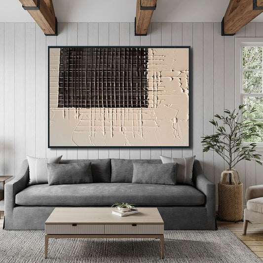 Modern living room with a gray sofa, coffee table, and abstract wall art.