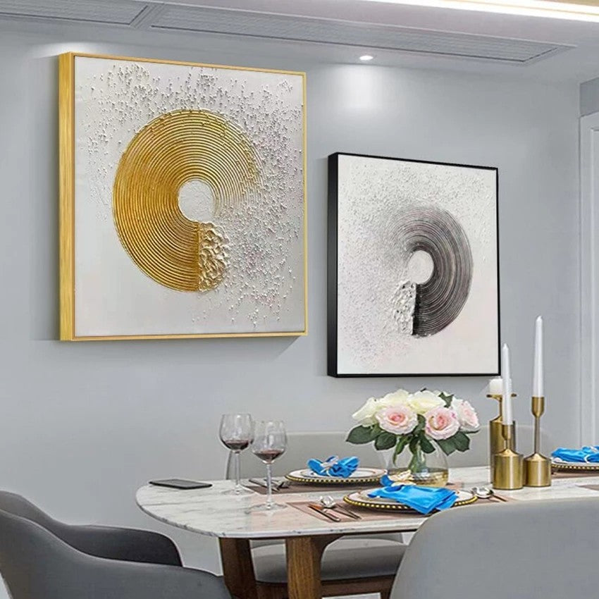 Dining room with abstract wall art and a set table.